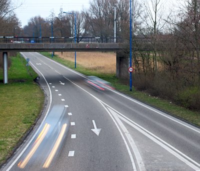 Blurred moving cars due to slow shutter speed